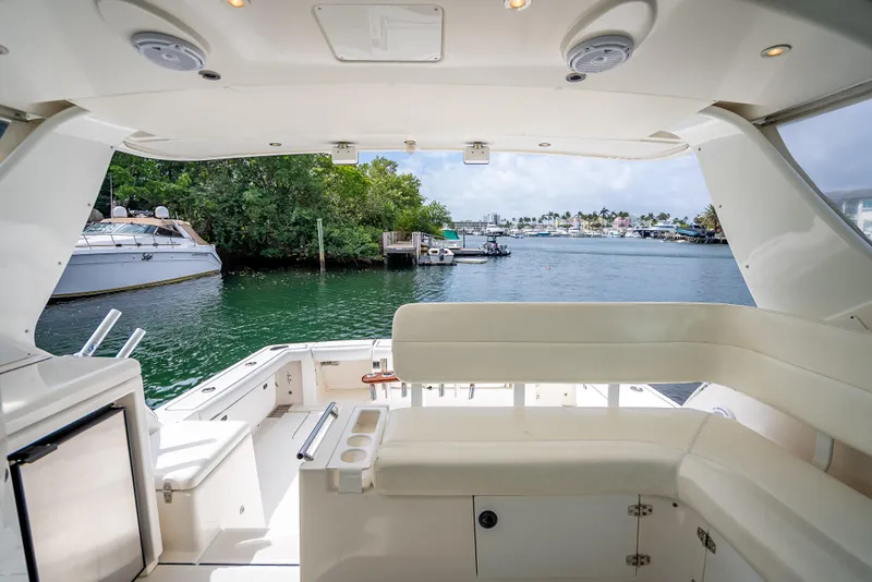 Slide: The Image of 2005 Tiara Yachts 4200 Open interior, featuring spacious seating and scenic marina view. - 37