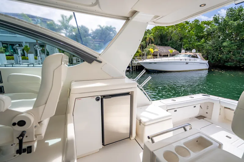 Slide: The Image of 2005 Tiara Yachts 4200 Open interior, featuring sleek design and waterfront view. - 38