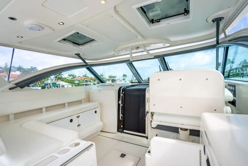 Slide: The Image of 2005 Tiara Yachts 4200 Open interior with white seating and panoramic windows. - 40