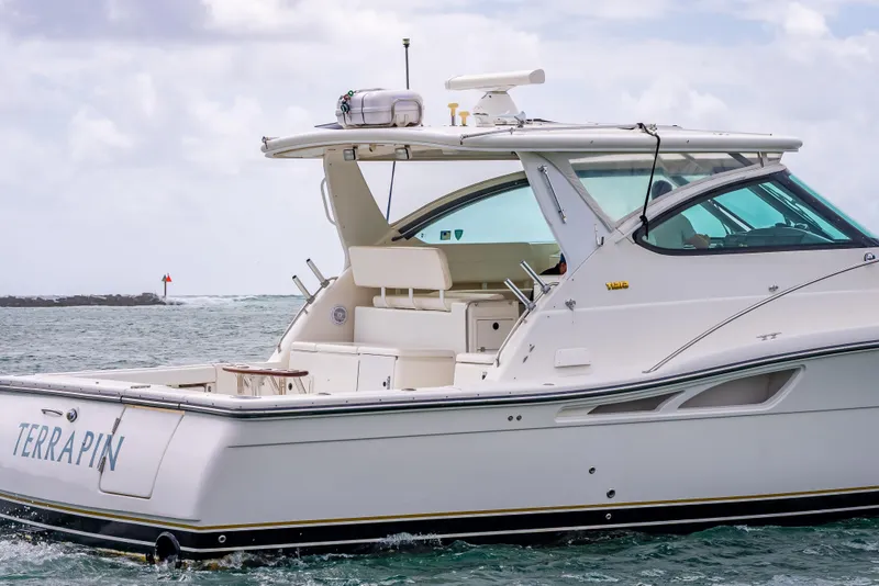 Slide: The Image of 2005 Tiara Yachts 4200 Open cruising on the water, side view. - 5