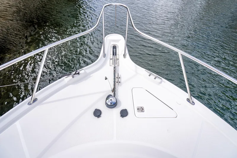 Slide: The Image of Bow view of 2005 Tiara Yachts 4200 Open, featuring sleek design and stainless steel railings. - 7