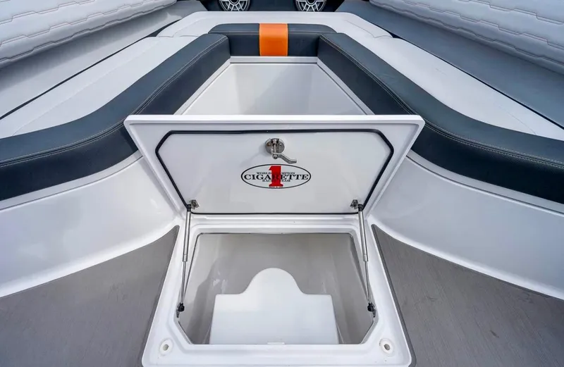 Slide: The Image of 2023 Cigarette 41 Nighthawk boat storage compartment with open lid, showcasing sleek interior design. - 8