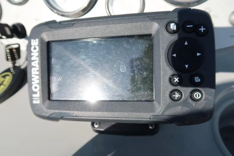 Slide: The Image of Lowrance marine GPS device on 2009 Bayliner 215 BR boat dashboard. - 14