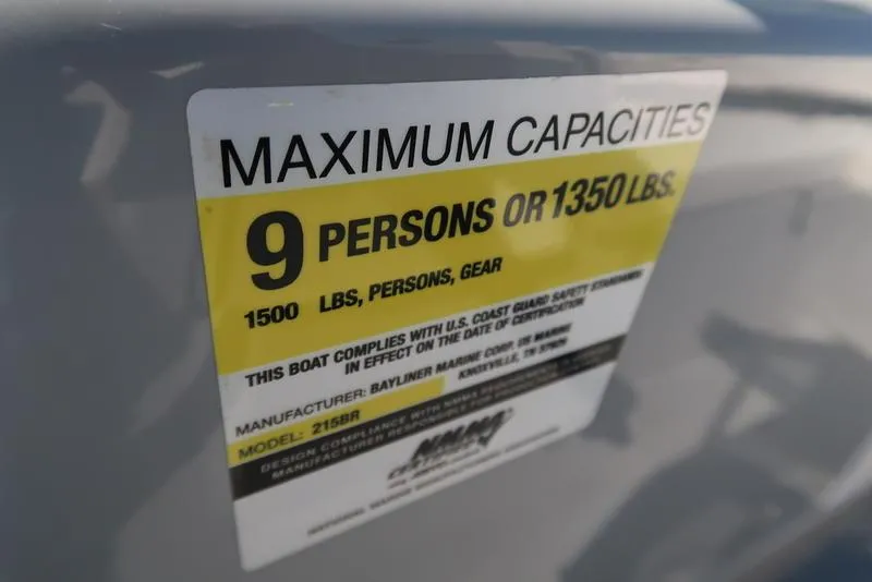 Slide: The Image of 2009 Bayliner 215 BR capacity label: 9 persons or 1350 lbs maximum. - 16