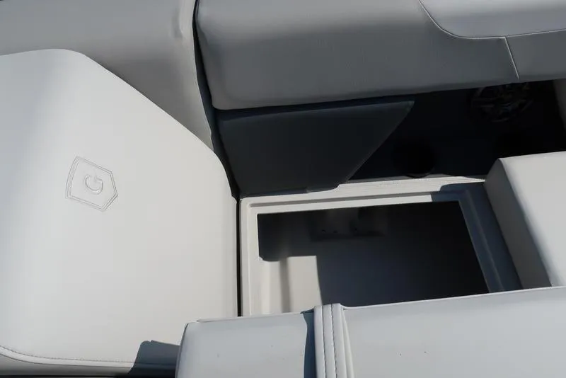 Slide: The Image of Interior seating of 2025 Godfrey Sweetwater 2286 QS boat, featuring storage compartment. - 28