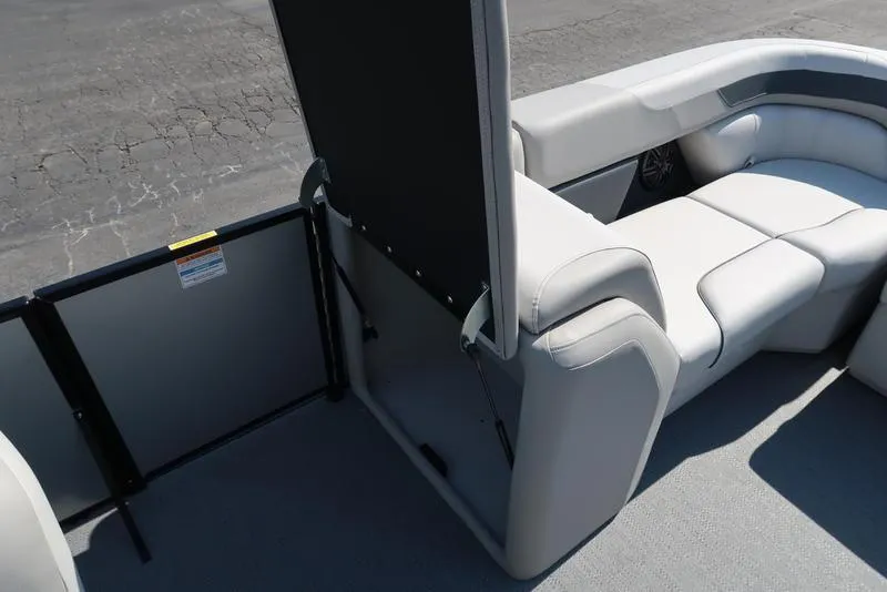 Slide: The Image of 2025 Godfrey Sweetwater 2286 QS boat interior with plush seating and storage compartment. - 29