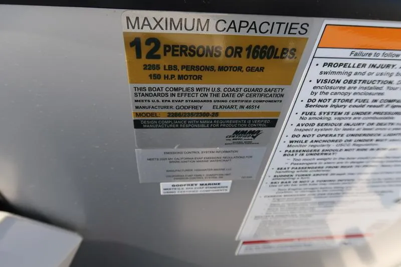 Slide: The Image of Capacity label on 2025 Godfrey Sweetwater 2286 QS, max 12 persons or 1660 lbs, 150 HP motor. - 33