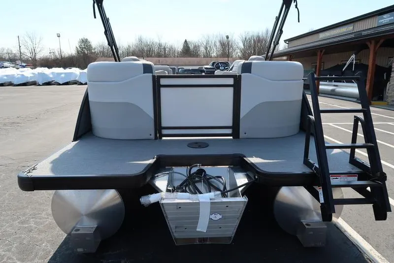 Slide: The Image of 2025 Godfrey Sweetwater 2286 QS pontoon boat, rear view with seating and ladder. - 5