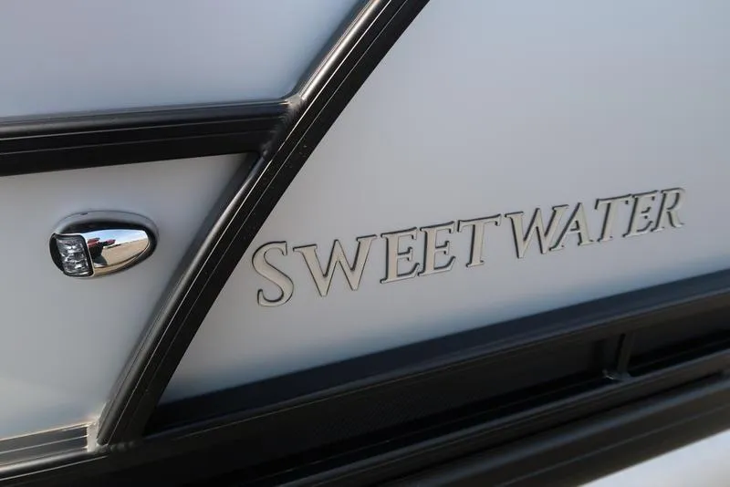Slide: The Image of Close-up of 2025 Godfrey Sweetwater 2286 QS boat logo and design detail. - 6