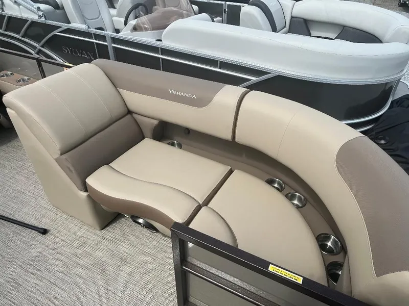 Slide: The Image of 2025 Veranda Relax VR22RC pontoon boat seating with beige and brown upholstery. - 13