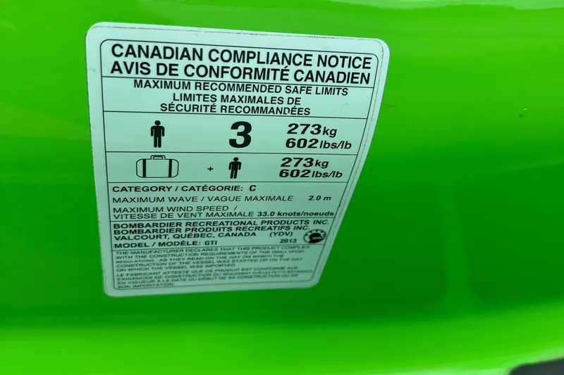 Slide: The Image of 2013 Sea-Doo GTI SE 130 compliance label, green background, maximum capacity 273 kg, 3 persons. - 10