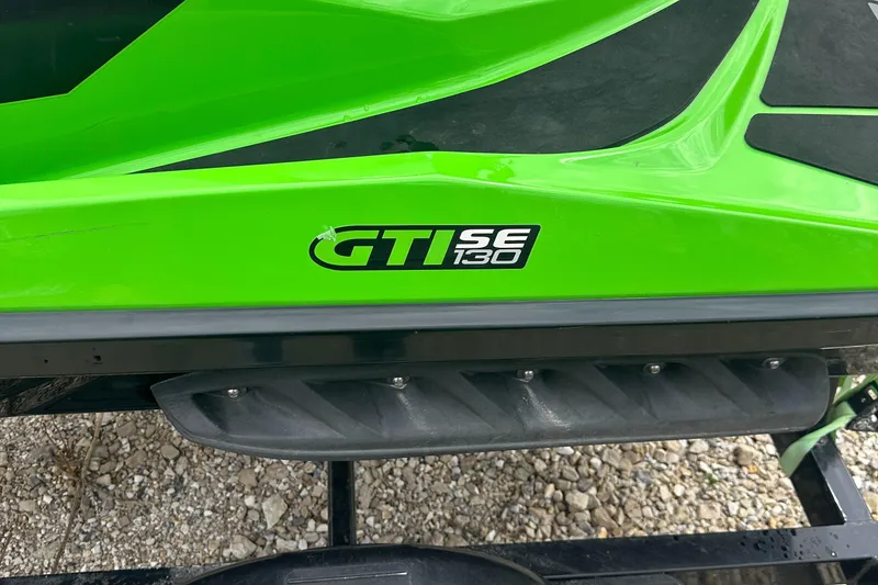 Slide: The Image of Green 2013 Sea-Doo GTI SE 130 jet ski, close-up of model logo. - 5