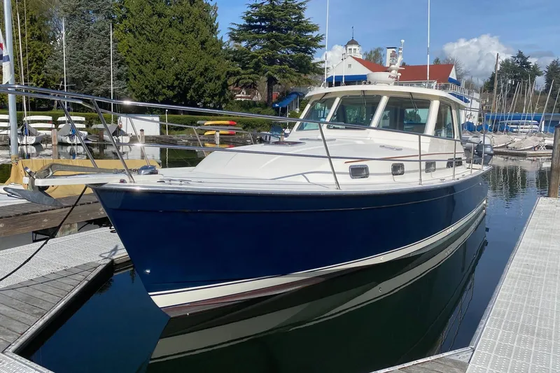 Slide: The Image of 2007 Sabre 38 Hardtop Express boat docked in a marina. - 0