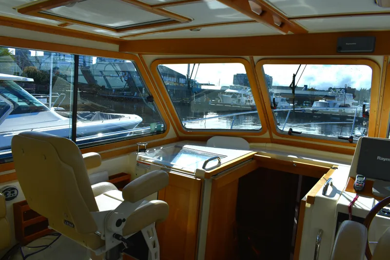 Slide: The Image of Interior view of 2007 Sabre 38 Hardtop Express yacht with marina backdrop. - 11