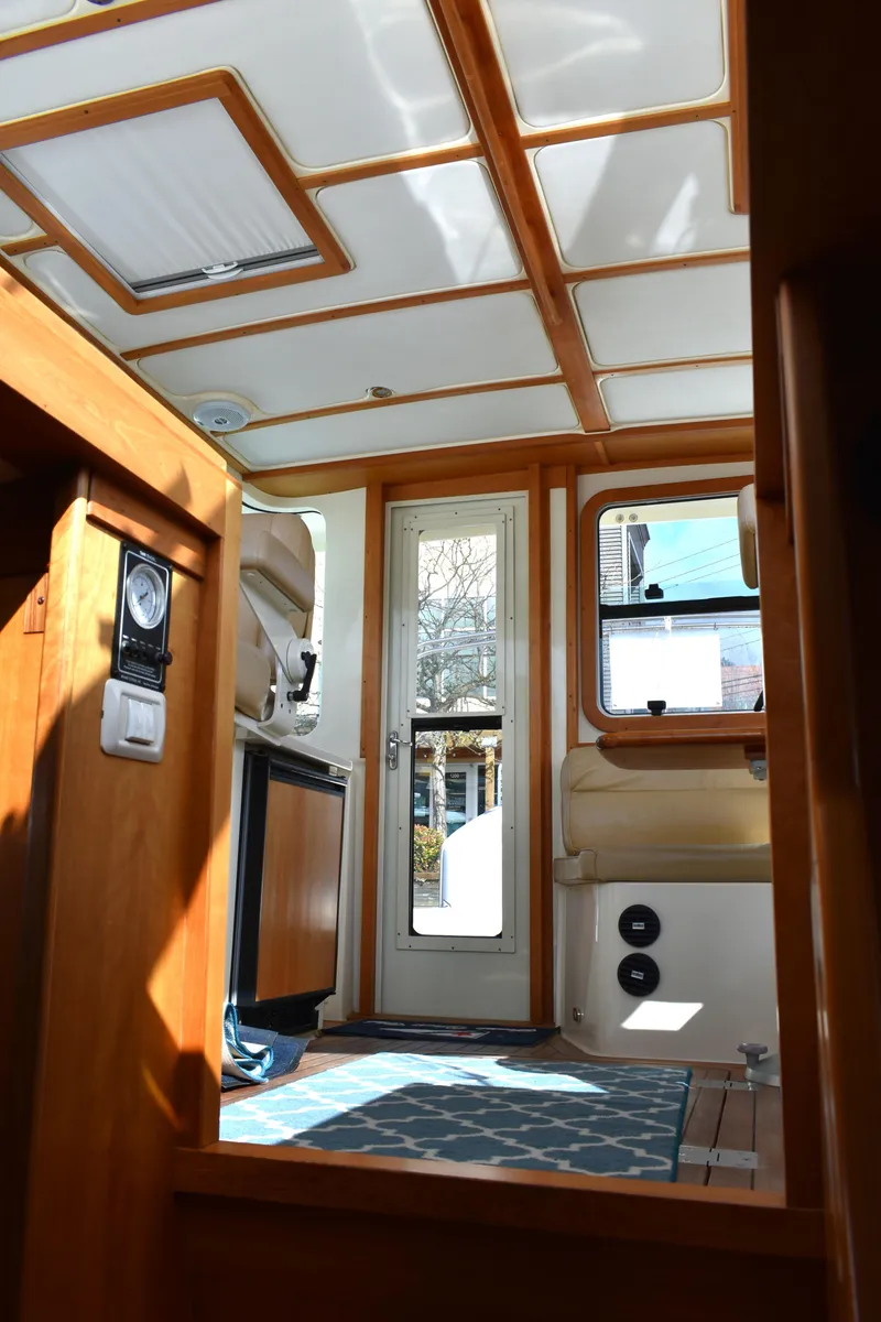Slide: The Image of Interior view of 2007 Sabre 38 Hardtop Express with wooden accents and natural light. - 14