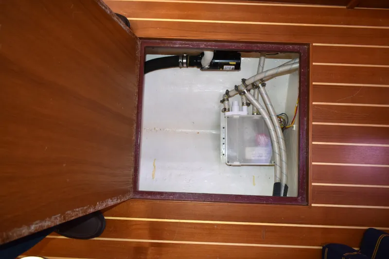 Slide: The Image of Bilge compartment of 2007 Sabre 38 Hardtop Express with visible hoses and equipment. - 26
