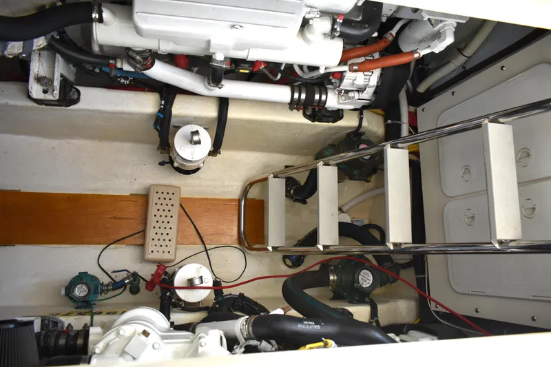 Slide: The Image of Engine room of 2007 Sabre 38 Hardtop Express with visible components and ladder access. - 28