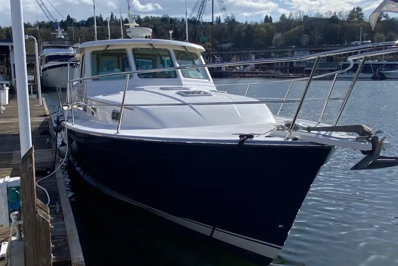 Slide: The Image of 2007 Sabre 38 Hardtop Express yacht docked at marina, front view. - 3