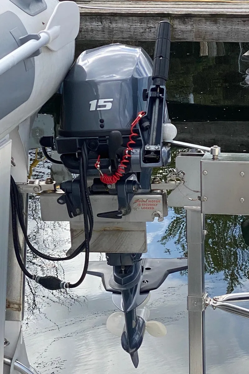 Slide: The Image of Outboard motor on a 2007 Sabre 38 Hardtop Express boat, docked by the water. - 30