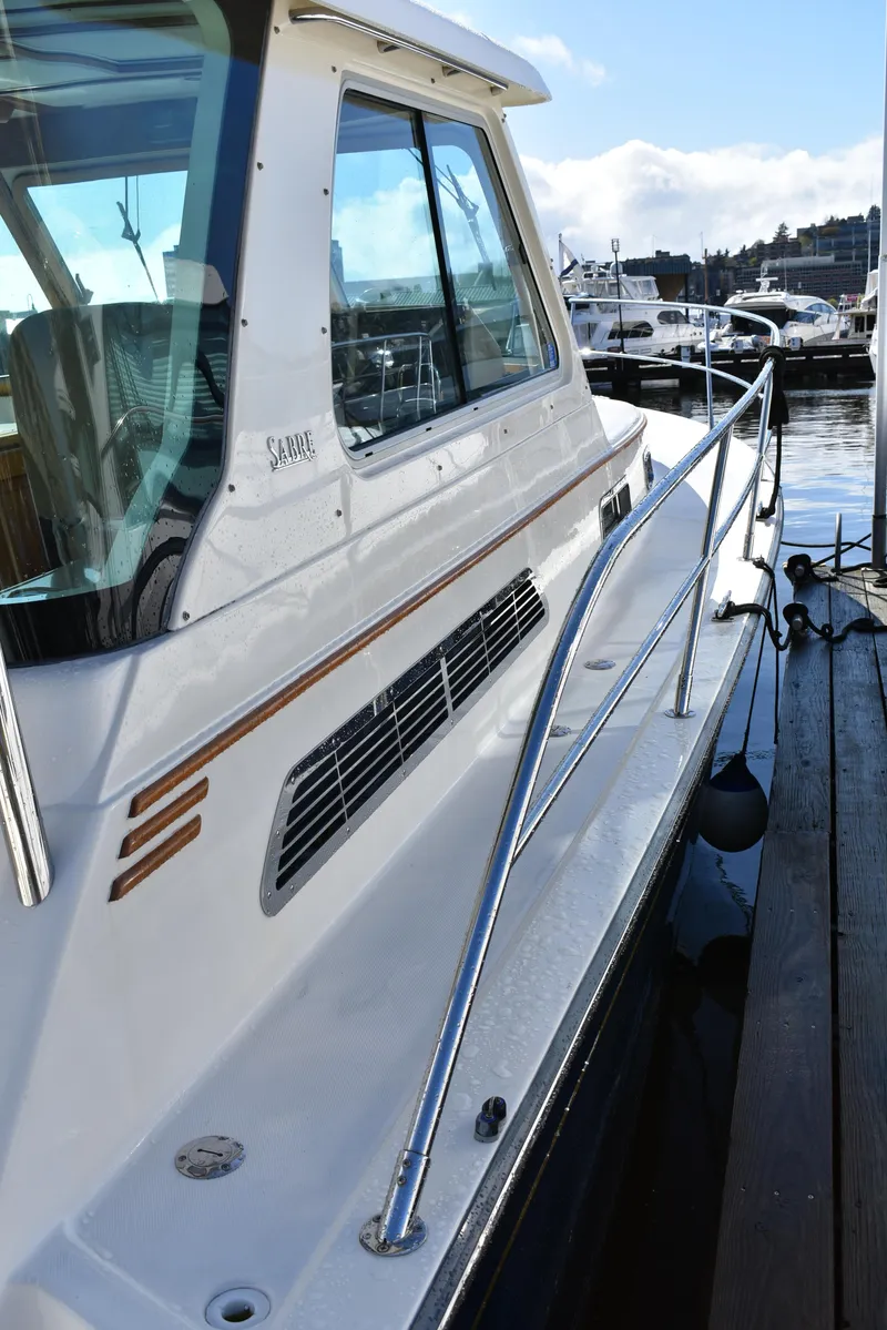 Slide: The Image of 2007 Sabre 38 Hardtop Express yacht docked at marina, side view. - 7