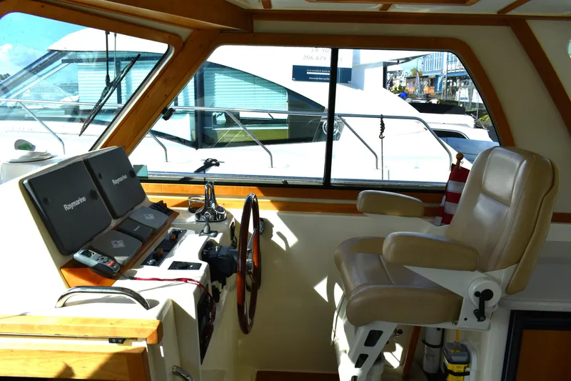Slide: The Image of 2007 Sabre 38 Hardtop Express helm with navigation equipment and captain's chair. - 8