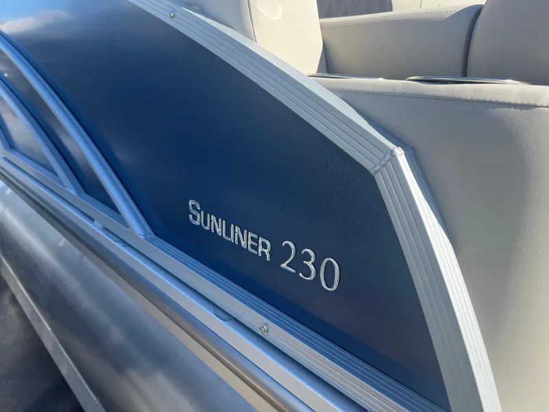 Slide: The Image of 2024 Harris FloteBote Sunliner 230 pontoon boat, blue and gray seating detail. - 18