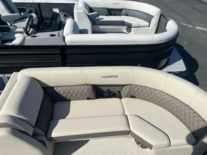 Slide: The Image of 2024 Harris FloteBote Sunliner 230 pontoon boat with luxurious seating and modern design. - 2