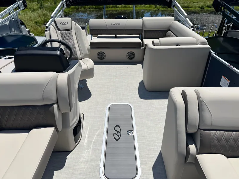 Slide: The Image of 2024 Harris FloteBote Sunliner 230 interior with beige seating and modern design. - 5