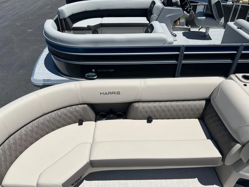 Slide: The Image of 2024 Harris FloteBote Sunliner 230 pontoon boat with luxurious seating and modern design. - 6
