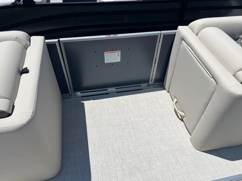 Slide: The Image of 2024 Harris FloteBote Sunliner 230 interior seating with beige upholstery and sleek design. - 7