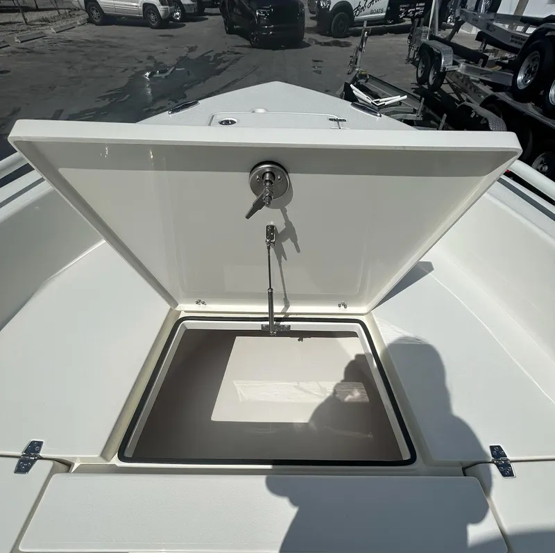 Slide: The Image of Open storage compartment on 2025 Pathfinder 2600 TRS boat, showcasing interior space. - 4