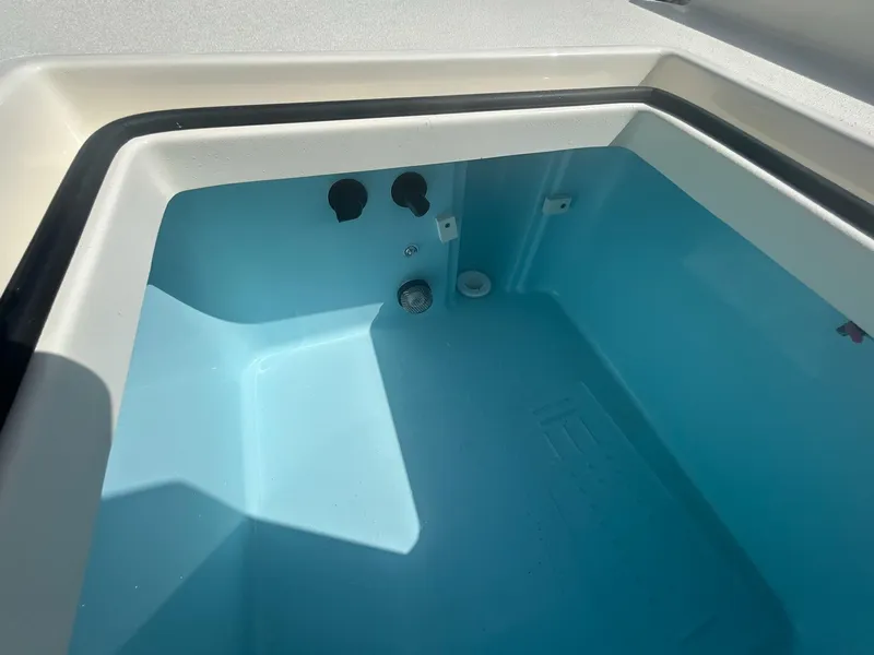 Slide: The Image of Interior view of 2025 Pathfinder 2600 TRS boat compartment, featuring a clean, light blue finish. - 6