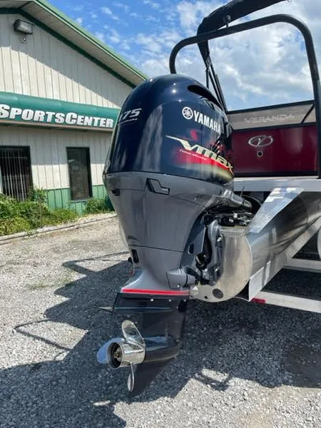 Slide: The Image of 2023 Veranda VR22VLC boat with Yamaha 175 engine at a sports center. - 2
