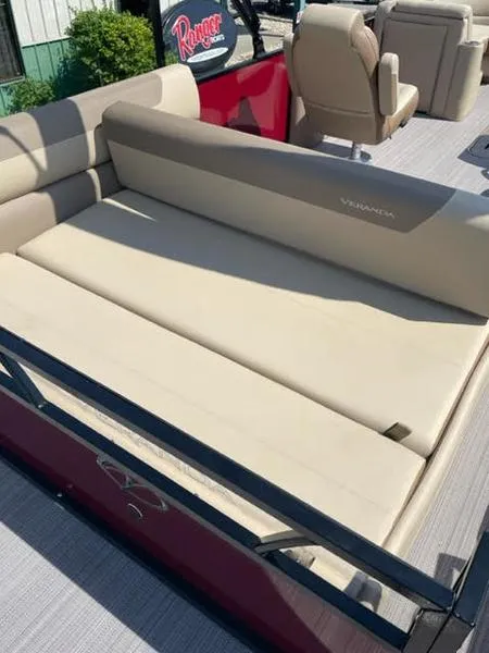 Slide: The Image of 2023 Veranda VR22VLC pontoon boat with beige seating and red accents. - 4