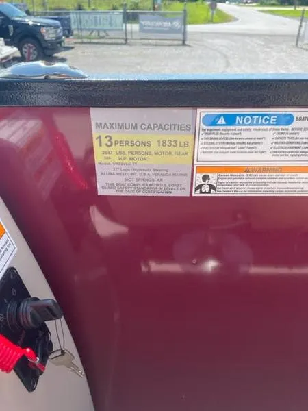 Slide: The Image of 2023 Veranda VR22VLC capacity label, 13 persons, 1833 lbs, safety notices visible. - 6
