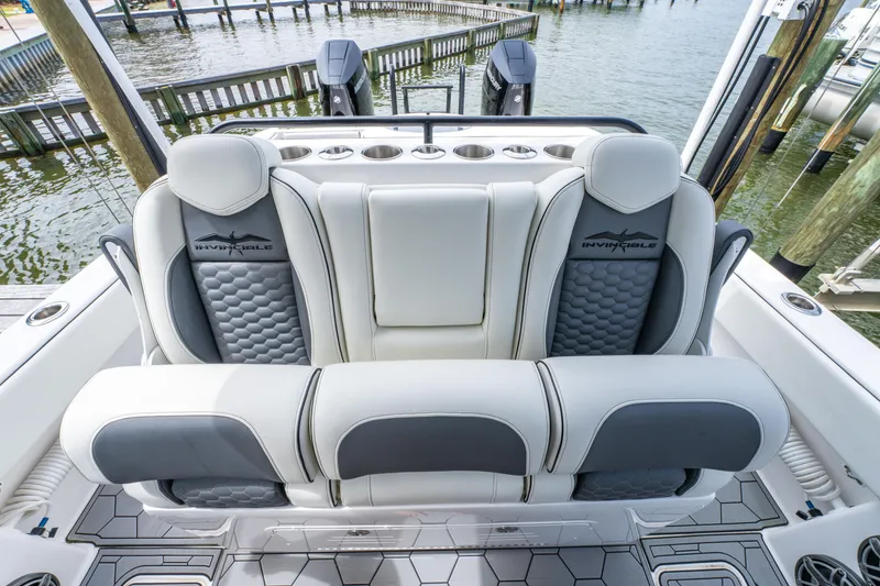 Slide: The Image of 2024 Invincible 33 Catamaran interior seating with stylish design and waterfront view. - 15