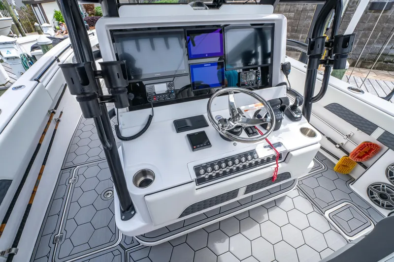 Slide: The Image of 2024 Invincible 33 Catamaran helm with advanced navigation and control systems. - 18