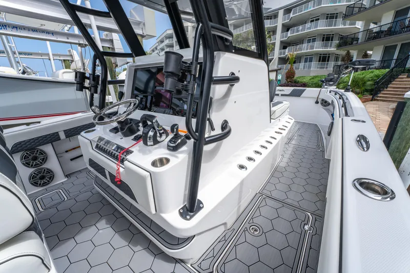 Slide: The Image of 2024 Invincible 33 Catamaran cockpit with modern controls and sleek design. - 22