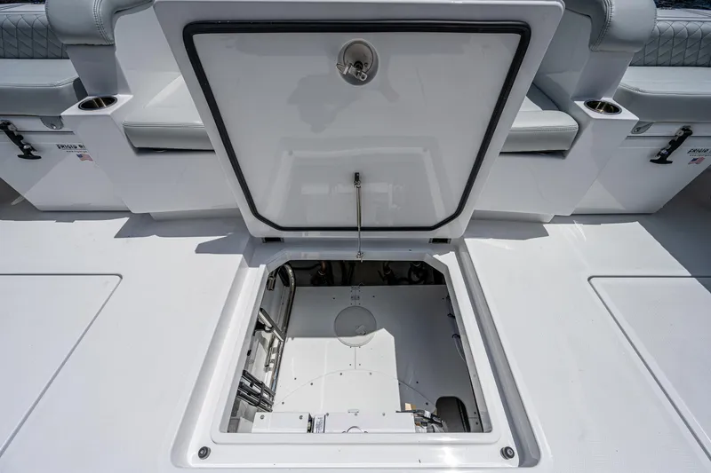 Slide: The Image of 2023 HCB 53 Sueños boat hatch open, revealing storage compartment. - 13