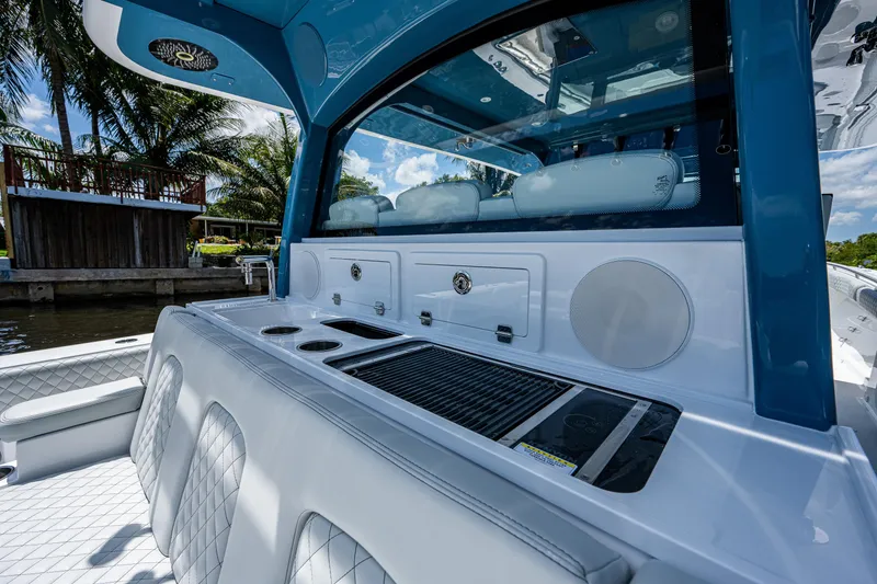 Slide: The Image of 2023 HCB 53 Sueños luxury boat interior with seating and entertainment area. - 22