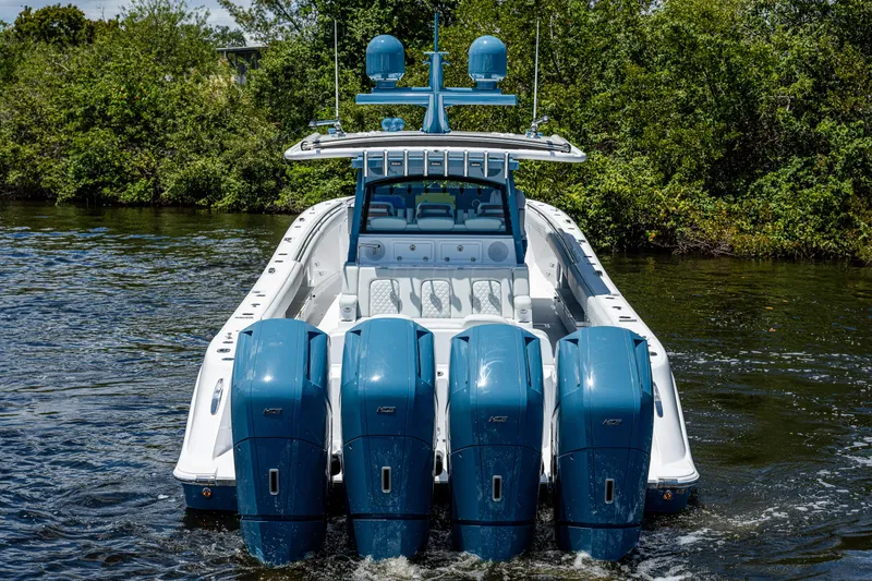 Slide: The Image of 2023 HCB 53 Sueños boat with four powerful outboard engines on the water. - 3