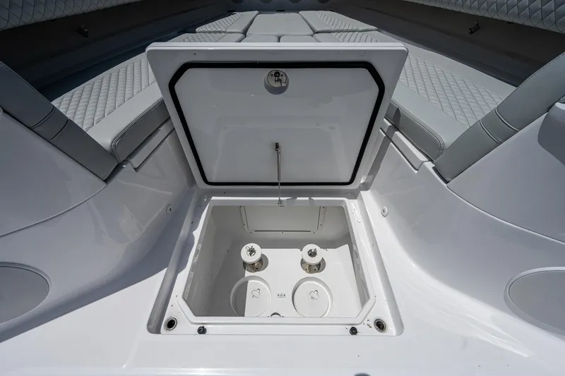 Slide: The Image of 2023 HCB 53 Sueños boat storage compartment with open hatch, showcasing interior design. - 39