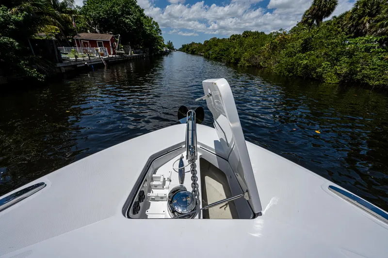 Slide: The Image of Bow view of 2023 HCB 53 Sueños yacht navigating a scenic waterway. - 40