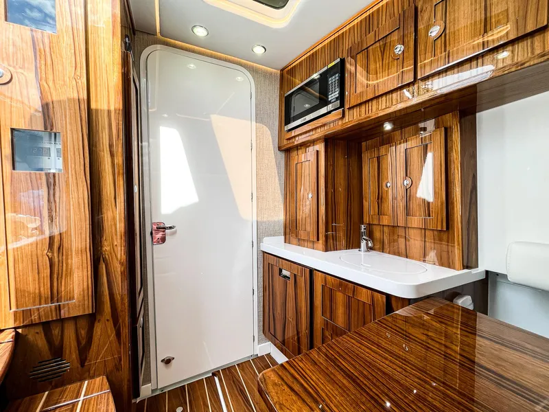 Slide: The Image of Luxurious interior of 2023 HCB 53 Sueños yacht with wood finish and modern amenities. - 45