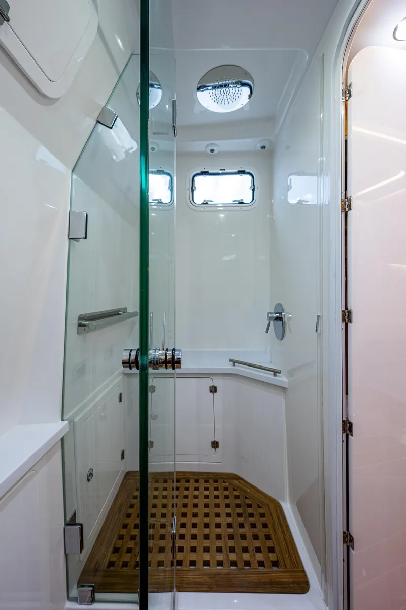 Slide: The Image of 2023 HCB 53 Sueños yacht shower with glass door and wooden floor. - 47