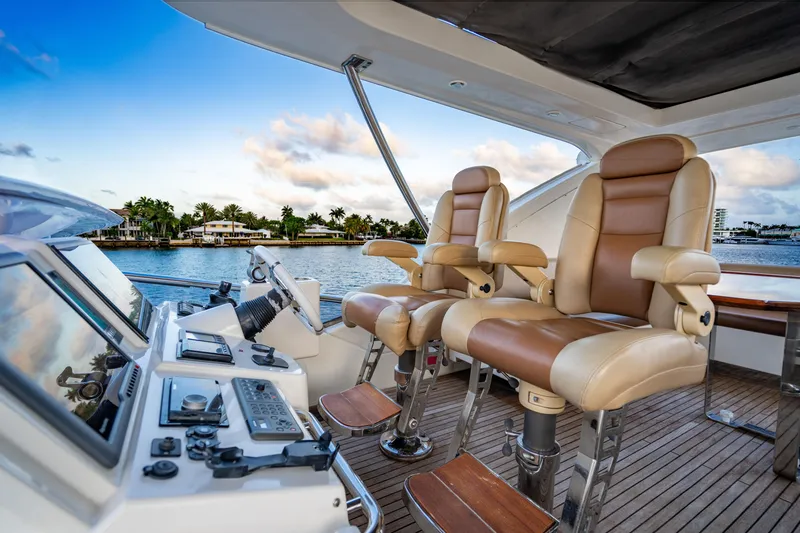 Slide: The Image of Luxurious helm of 2011 Azimut 70 Fly yacht with leather seats and control panel. - 14