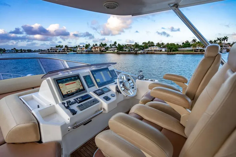 Slide: The Image of Luxurious helm of 2011 Azimut 70 Fly yacht with scenic waterfront view. - 18