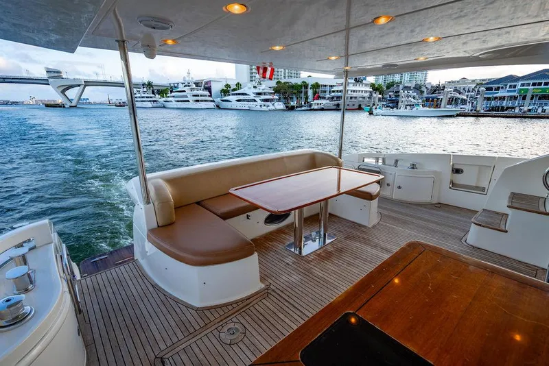 Slide: The Image of Luxurious 2011 Azimut 70 Fly yacht deck with seating, overlooking marina. - 2