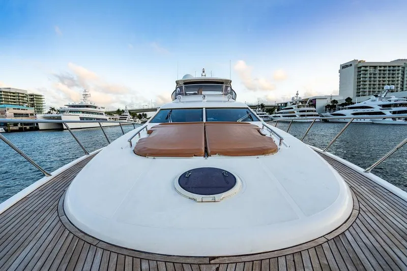 Slide: The Image of Azimut 70 Fly 2011 yacht docked at marina, showcasing sleek design and spacious deck. - 22