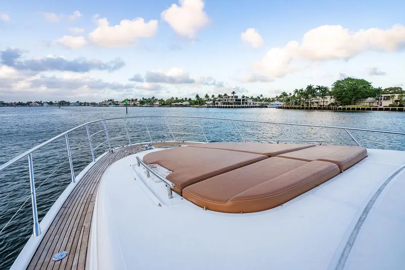Slide: The Image of Front deck of 2011 Azimut 70 Fly yacht with scenic waterfront view. - 24